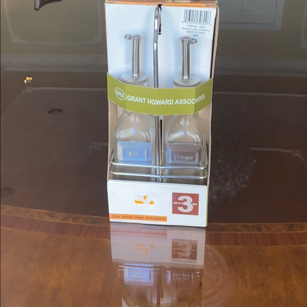 Oil and vinegar set with a chrome plated rack.